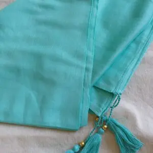 Pareo pompón turquesa