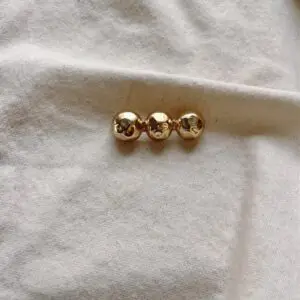 Broche bolitas