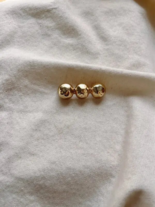Broche bolitas